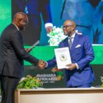 Handshake between Mory Diané, founder of Scanning Systems (left), and the Executive Secretary of the AfCFTA, Wamkele Mene, during the signing of the Memorandum of Understanding.